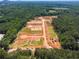 Expansive aerial of new community development in progress, showcasing layout of streets and future homesites at 15 Dartmoor Cir, Dallas, GA 30157