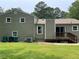 The back exterior of this home has a deck and a large grassy yard at 3100 Karen Ne Ln, Marietta, GA 30062