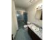A full bathroom with a step in shower, tile floor and single sink vanity at 3100 Karen Ne Ln, Marietta, GA 30062