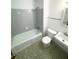 Traditional bathroom featuring tub with shower and unique tile floor at 3100 Karen Ne Ln, Marietta, GA 30062