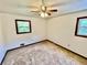 Bedroom featuring two windows, carpet and a ceiling fan at 3100 Karen Ne Ln, Marietta, GA 30062
