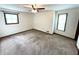 A primary bedroom featuring two windows, carpeted floor and ample natural light at 3100 Karen Ne Ln, Marietta, GA 30062