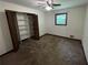 Bedroom features ample closet space and a ceiling fan at 3100 Karen Ne Ln, Marietta, GA 30062