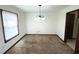A dining room featuring a chandelier, carpeted floor and ample natural light at 3100 Karen Ne Ln, Marietta, GA 30062