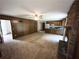 Spacious living room flows into kitchen area with a stone fireplace at 3100 Karen Ne Ln, Marietta, GA 30062