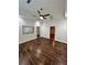 A bright bedroom features wood-look floors, a ceiling fan, and windows at 701 Cameron M Alexander Nw Blvd, Atlanta, GA 30318