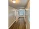 A bright hallway with wood-look floors, and modern fixtures at 701 Cameron M Alexander Nw Blvd, Atlanta, GA 30318