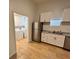 Kitchen and laundry room with modern stainless steel appliances and white cabinets at 701 Cameron M Alexander Nw Blvd, Atlanta, GA 30318