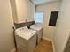 Laundry room with washer, dryer, cabinets, and window at 701 Cameron M Alexander Nw Blvd, Atlanta, GA 30318
