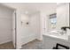 Bright, clean bathroom featuring a tub, double sinks, and modern fixtures at 1315 Aura Ln, Lawrenceville, GA 30045