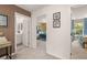 Bright hallway features neutral carpet, white trim and leads to a bathroom and bedroom at 1315 Aura Ln, Lawrenceville, GA 30045