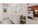 Stylish bathroom with double sinks, a window view, and seamless flow to the main bedroom at 1315 Aura Ln, Lawrenceville, GA 30045