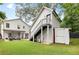 View of the backyard, showing the detached garage and outdoor seating area at 313 Sisson Ne Ave, Atlanta, GA 30317