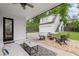 Backyard patio with outdoor seating, fire pit, and detached garage at 313 Sisson Ne Ave, Atlanta, GA 30317