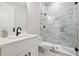 Modern bathroom featuring a sleek vanity, glass-enclosed shower with tile, and contemporary fixtures at 313 Sisson Ne Ave, Atlanta, GA 30317