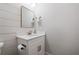 Elegant half-bathroom showcasing shiplap walls, modern fixtures, and a stylish vanity at 313 Sisson Ne Ave, Atlanta, GA 30317