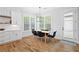 Bright dining area features natural lighting, hardwood flooring, and modern decor at 313 Sisson Ne Ave, Atlanta, GA 30317
