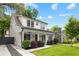 Beautiful home featuring a lush green lawn, a covered porch, and a private driveway at 313 Sisson Ne Ave, Atlanta, GA 30317