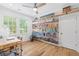 Office features hardwood floors, a ceiling fan and many bookshelves at 313 Sisson Ne Ave, Atlanta, GA 30317