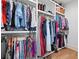 Organized walk-in closet with shelving and hanging racks for clothes and accessories at 313 Sisson Ne Ave, Atlanta, GA 30317