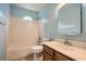 Bathroom with tiled shower, vanity, mirror, and tiled accents at 3404 Bodiford Path Path, Powder Springs, GA 30127