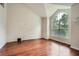 Bedroom features a large arched window, providing lots of natural light and a view of the outdoors at 3404 Bodiford Path Path, Powder Springs, GA 30127