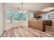 Bright kitchen nook with hardwood floors and several windows offering lots of natural light at 3404 Bodiford Path Path, Powder Springs, GA 30127