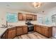 Spacious kitchen featuring wood cabinets, stainless steel appliances, and neutral countertops at 3404 Bodiford Path Path, Powder Springs, GA 30127