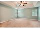 Main bedroom with neutral paint and carpet with many windows for natural lighting at 3404 Bodiford Path Path, Powder Springs, GA 30127