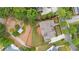 Aerial view showcasing the home, deck, and landscaped yard, highlighting its desirable location and curb appeal at 4530 Westgate Dr, Cumming, GA 30040