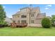 Expansive backyard features a wooden deck and well-maintained lawn at 4530 Westgate Dr, Cumming, GA 30040