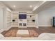 Finished basement with built-in shelves and tv at 4530 Westgate Dr, Cumming, GA 30040