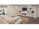 Finished basement with built-in shelves and tv at 4530 Westgate Dr, Cumming, GA 30040