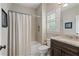 Bathroom featuring granite countertops, a tub and shower combo, and neutral walls at 4530 Westgate Dr, Cumming, GA 30040