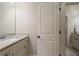 Neutral bathroom featuring a granite countertop, and white wooden cabinets and trim at 4530 Westgate Dr, Cumming, GA 30040