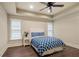 Cozy bedroom with a trey ceiling, ceiling fan, and lots of natural light from the two windows at 4530 Westgate Dr, Cumming, GA 30040