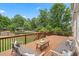 Relaxing outdoor deck area, perfect for lounging, with lush green surroundings and mature trees at 4530 Westgate Dr, Cumming, GA 30040