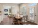 Bright dining area with wood table, seating for four, and access to the outdoor deck at 4530 Westgate Dr, Cumming, GA 30040