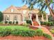 Charming two-story home boasts a covered porch, manicured lawn, and neutral-toned siding at 4530 Westgate Dr, Cumming, GA 30040