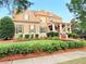 Inviting two-story home featuring a covered porch, landscaped yard, and neutral-toned exterior at 4530 Westgate Dr, Cumming, GA 30040