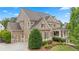 Stunning home showcasing manicured landscaping and a welcoming front porch at 4530 Westgate Dr, Cumming, GA 30040