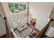 Aerial view of foyer with chandelier, fireplace, and staircase with a view into the dining area at 4530 Westgate Dr, Cumming, GA 30040