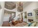 Spacious foyer with a staircase, fireplace and elegant chandelier at 4530 Westgate Dr, Cumming, GA 30040