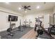 Home gym with modern equipment and black rubber flooring at 4530 Westgate Dr, Cumming, GA 30040