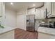 Kitchen with stainless steel fridge, granite countertops, and white cabinets at 4530 Westgate Dr, Cumming, GA 30040
