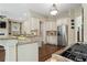 Kitchen featuring granite countertops, stainless steel refrigerator and an open concept design at 4530 Westgate Dr, Cumming, GA 30040