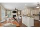 Open-concept living space featuring a kitchen island and views of the fireplace at 4530 Westgate Dr, Cumming, GA 30040
