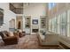 Elegant living room with a fireplace, large windows, and comfortable seating at 4530 Westgate Dr, Cumming, GA 30040