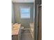 Well-lit bathroom with a tub, toilet, and sink with pink countertops beneath a window providing natural light at 109 Ivy Crest Dr, Dallas, GA 30157