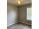 Bright bedroom featuring gray walls, ceiling fan, and new floors at 109 Ivy Crest Dr, Dallas, GA 30157